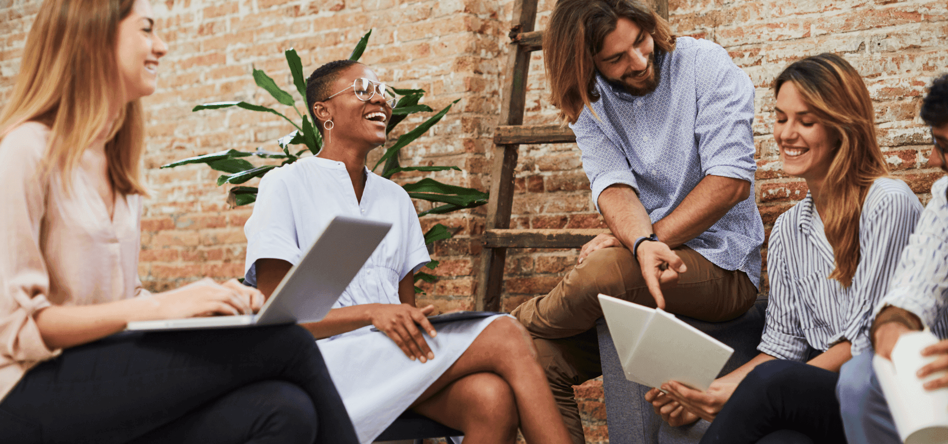Team meeting in a modern workspace with laptop and tablet – young professionals discussing politjobs, politics jobs, and opportunities on the political job board.