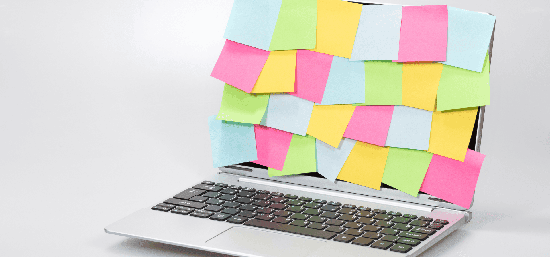 Laptop, screen is completely filled with colorful post-ists.