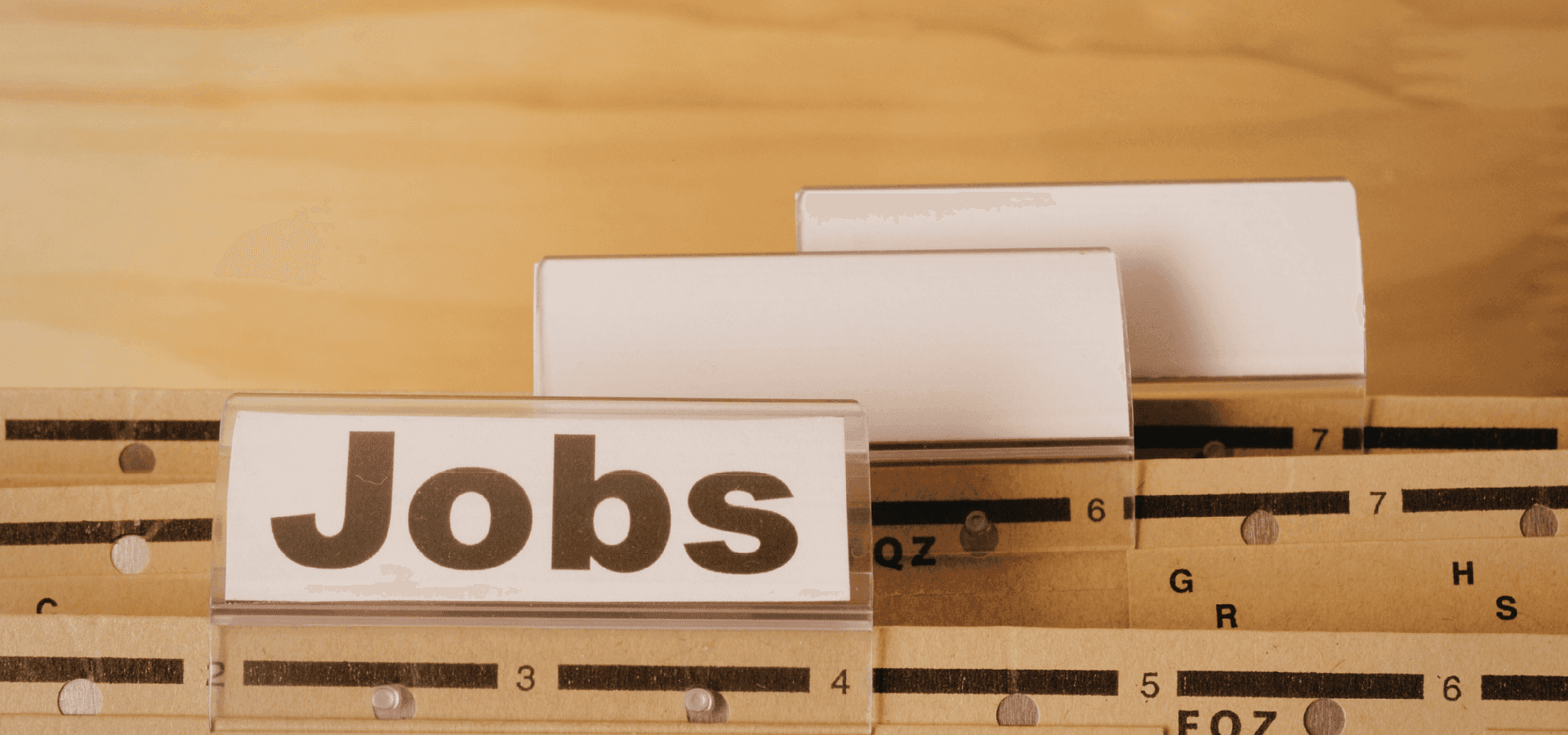 Files stacked one on top of the other, one labeled “Jobs”